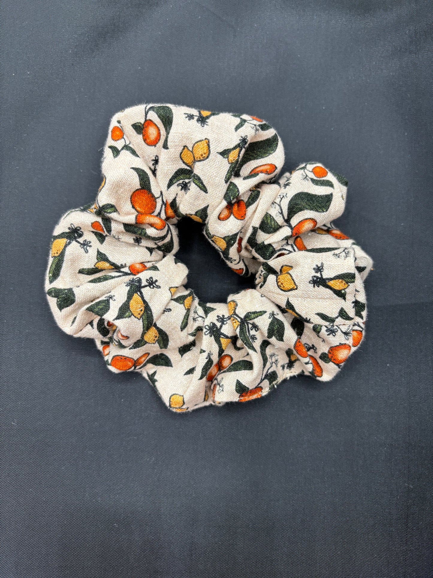 Scrunchie with fruit pattern on a dark background