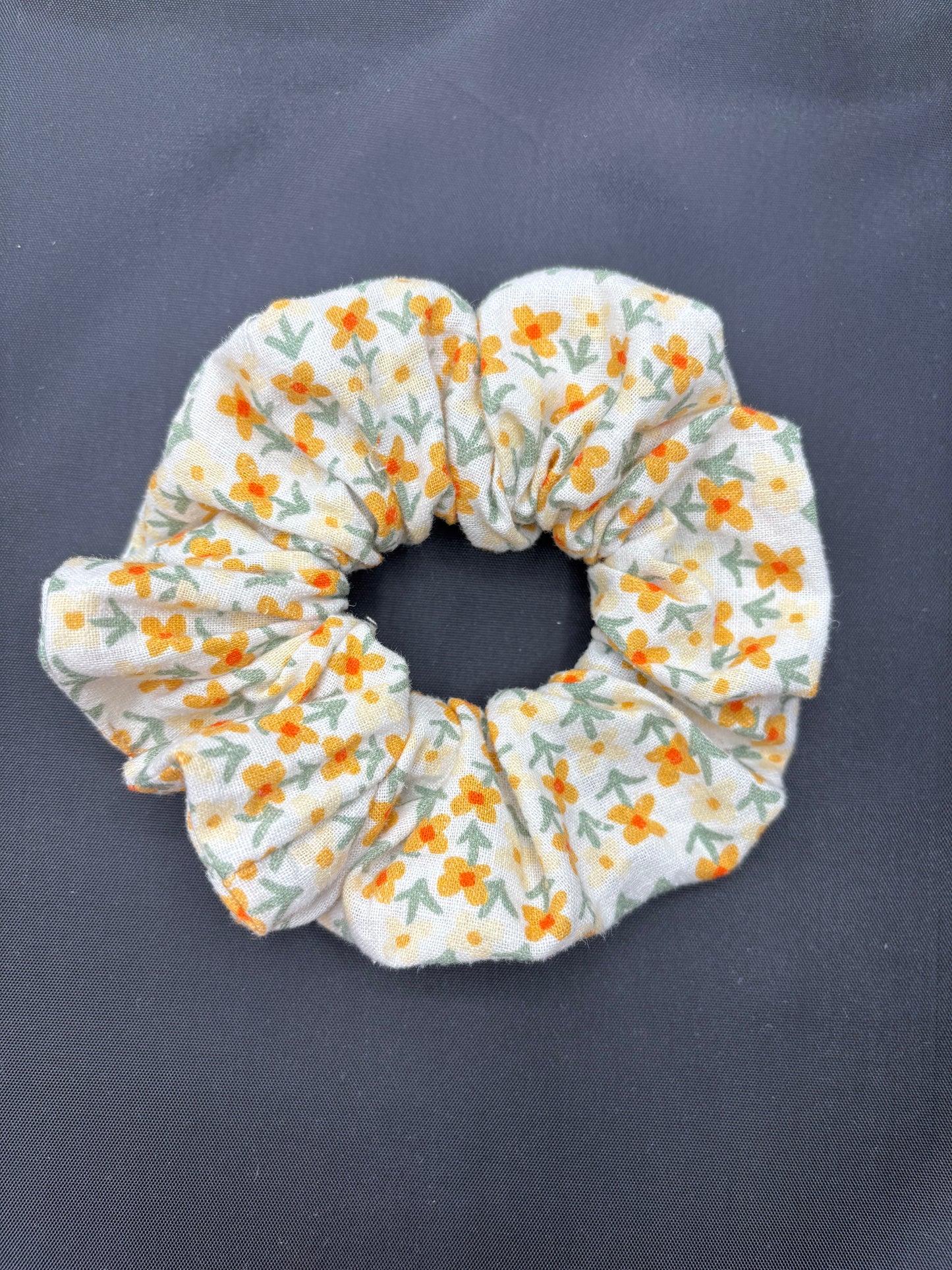 Floral patterned scrunchie on a dark background